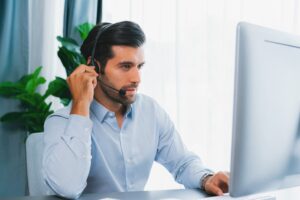 Call center agent talking to customer using headset